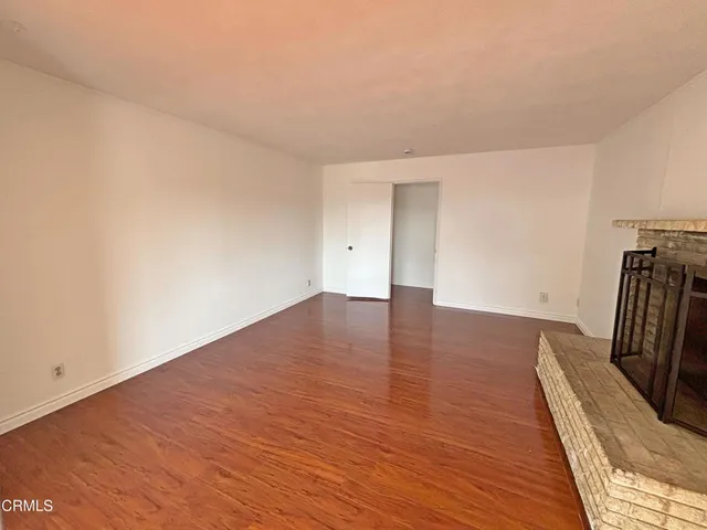a view of a livingroom with wooden floor