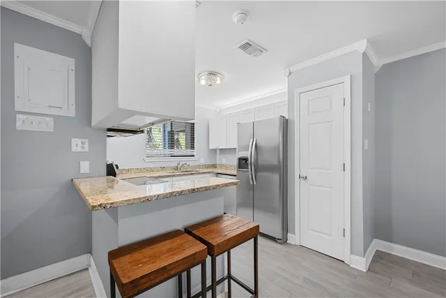 a kitchen with a table and chairs