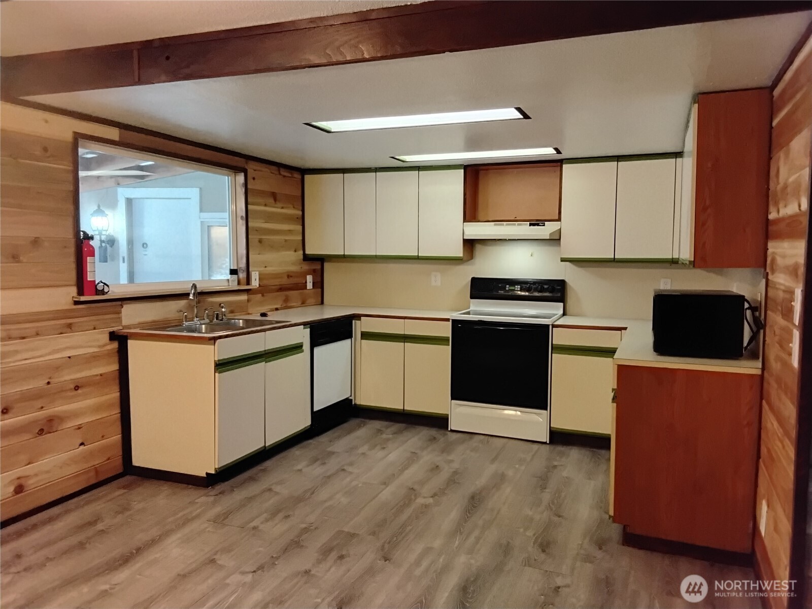 20 Round Up Road Oroville, WA 98844 - Photo 22 of 39 a kitchen with granite countertop a stove top oven and cabinets