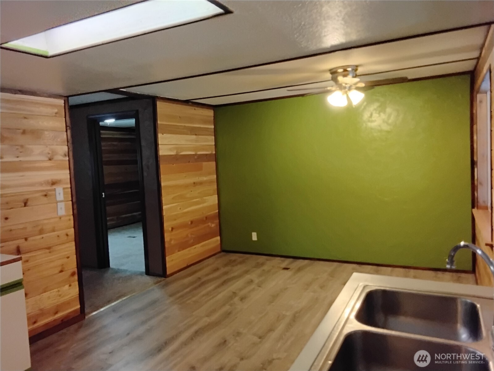 20 Round Up Road Oroville, WA 98844 - Photo 23 of 39 a view of a room with wooden floor and a ceiling fan