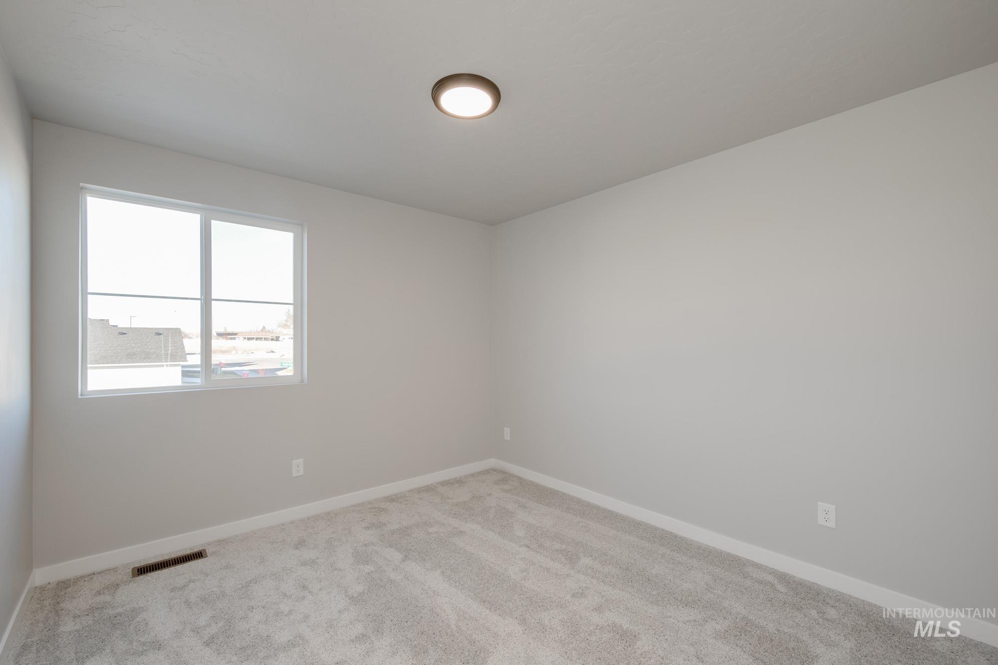 3210 South Maple Rnch Way Nampa, ID 83686 - Photo 20 of 22 Carpeted empty room with baseboards