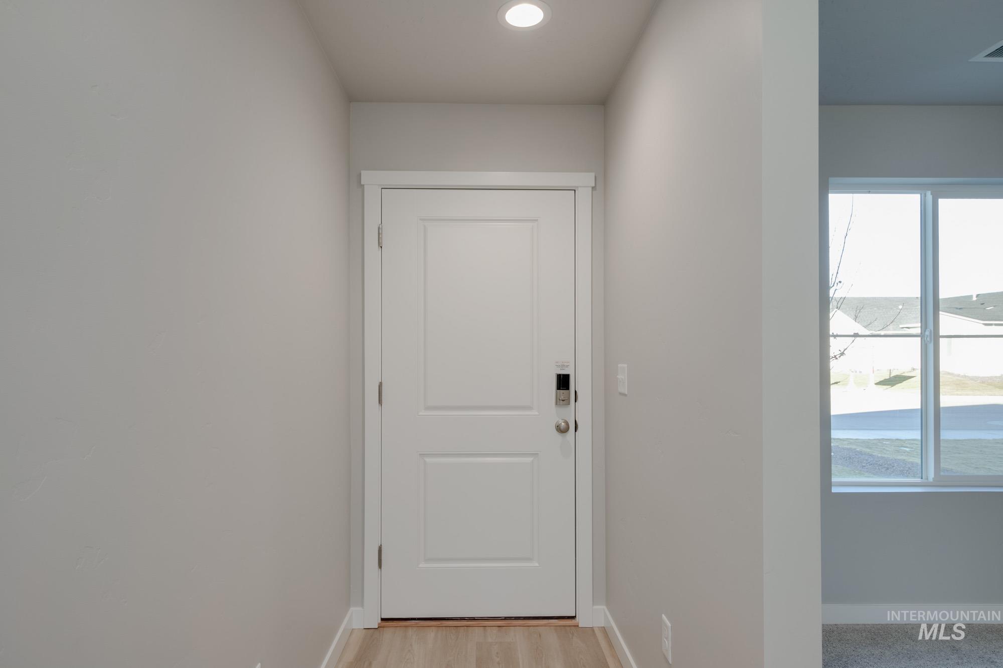 3210 South Maple Rnch Way Nampa, ID 83686 - Photo 3 of 22 Doorway featuring wood finished floors and recessed lighting