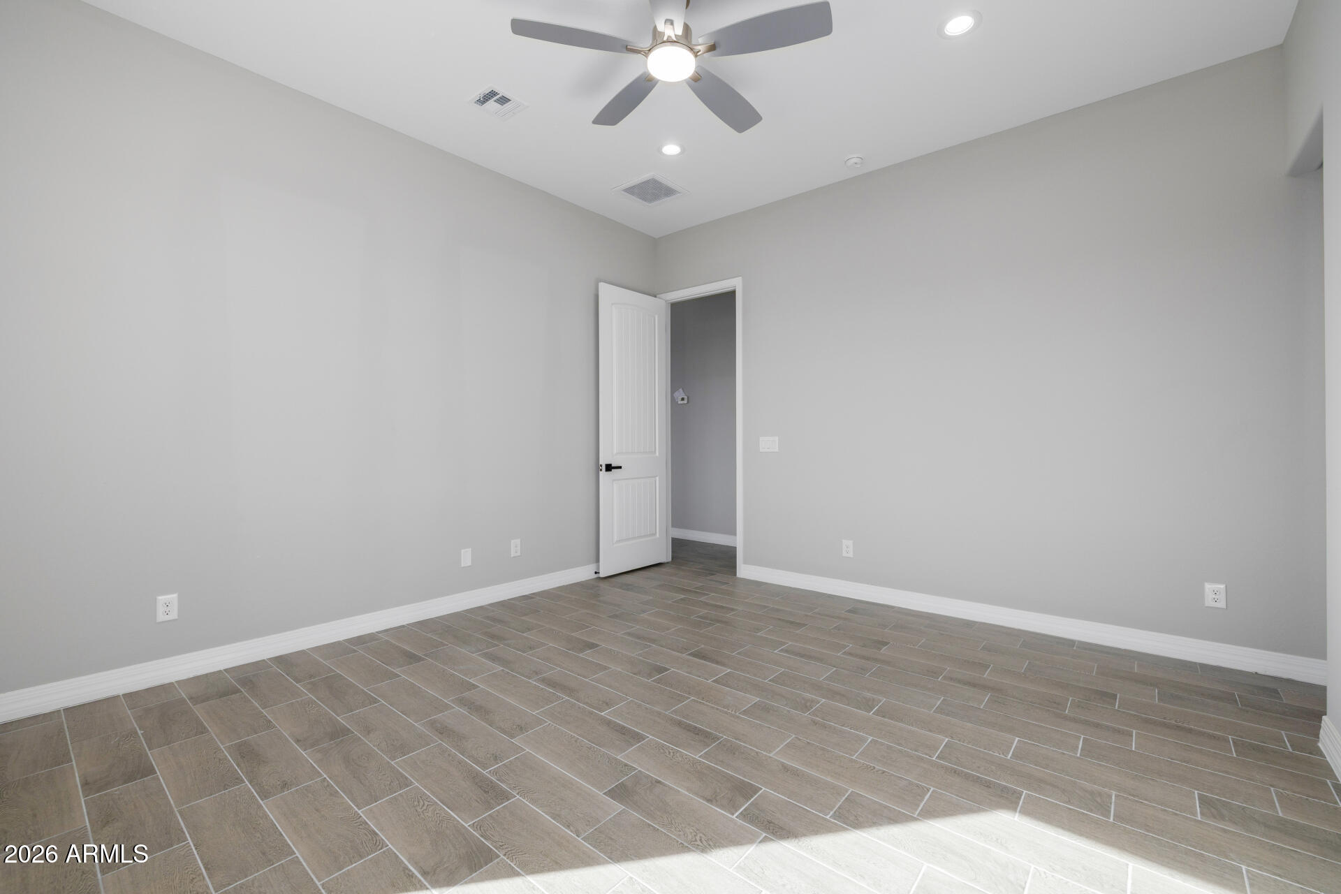 14099 South Vera Cruz Road Arizona City, AZ 85123 - Photo 15 of 32 wooden floor in an empty room