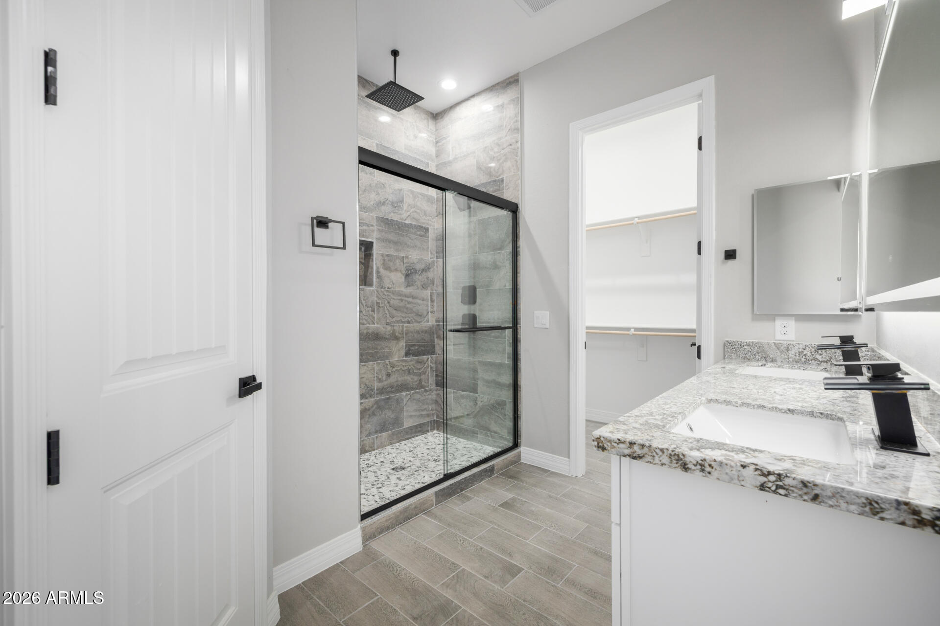 14099 South Vera Cruz Road Arizona City, AZ 85123 - Photo 16 of 32 a bathroom with a granite countertop sink a mirror and shower