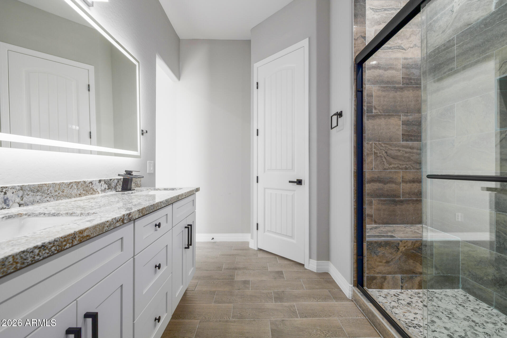14099 South Vera Cruz Road Arizona City, AZ 85123 - Photo 18 of 32 a bathroom with a granite countertop sink a mirror and a shower