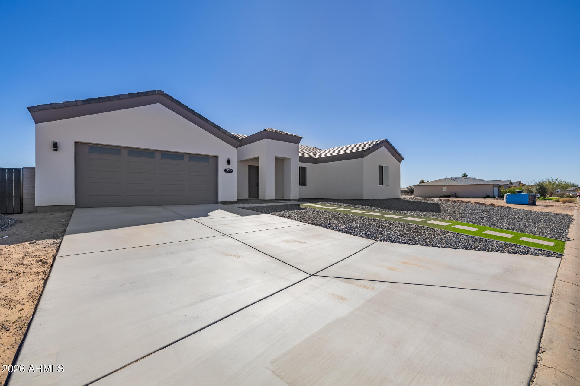 14099 South Vera Cruz Road Arizona City, AZ 85123 - Photo 2 of 32 a view of a house with a yard