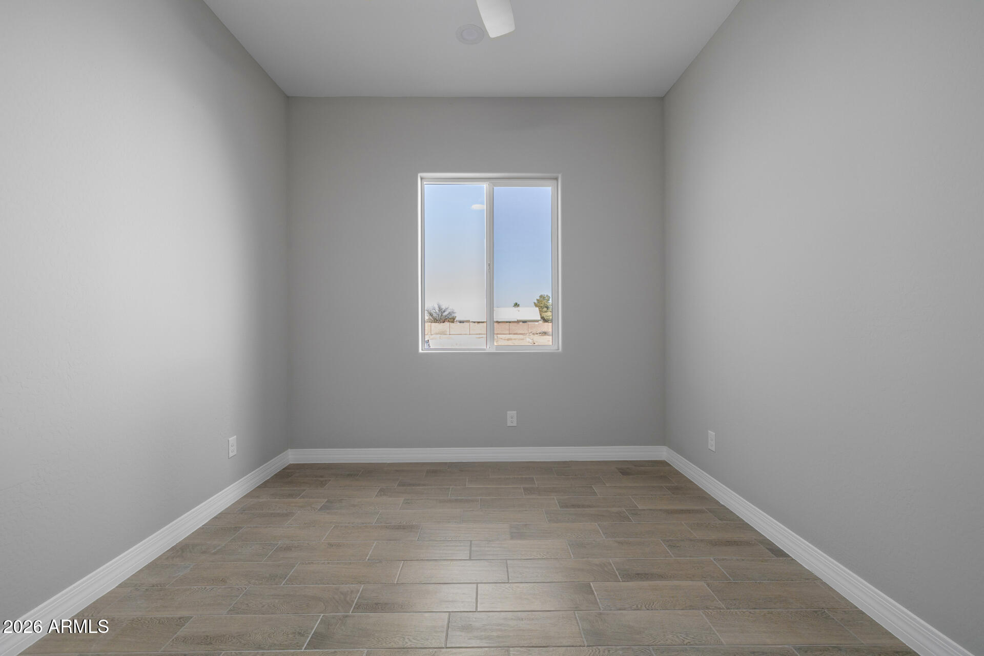 14099 South Vera Cruz Road Arizona City, AZ 85123 - Photo 25 of 32 an empty room with a window