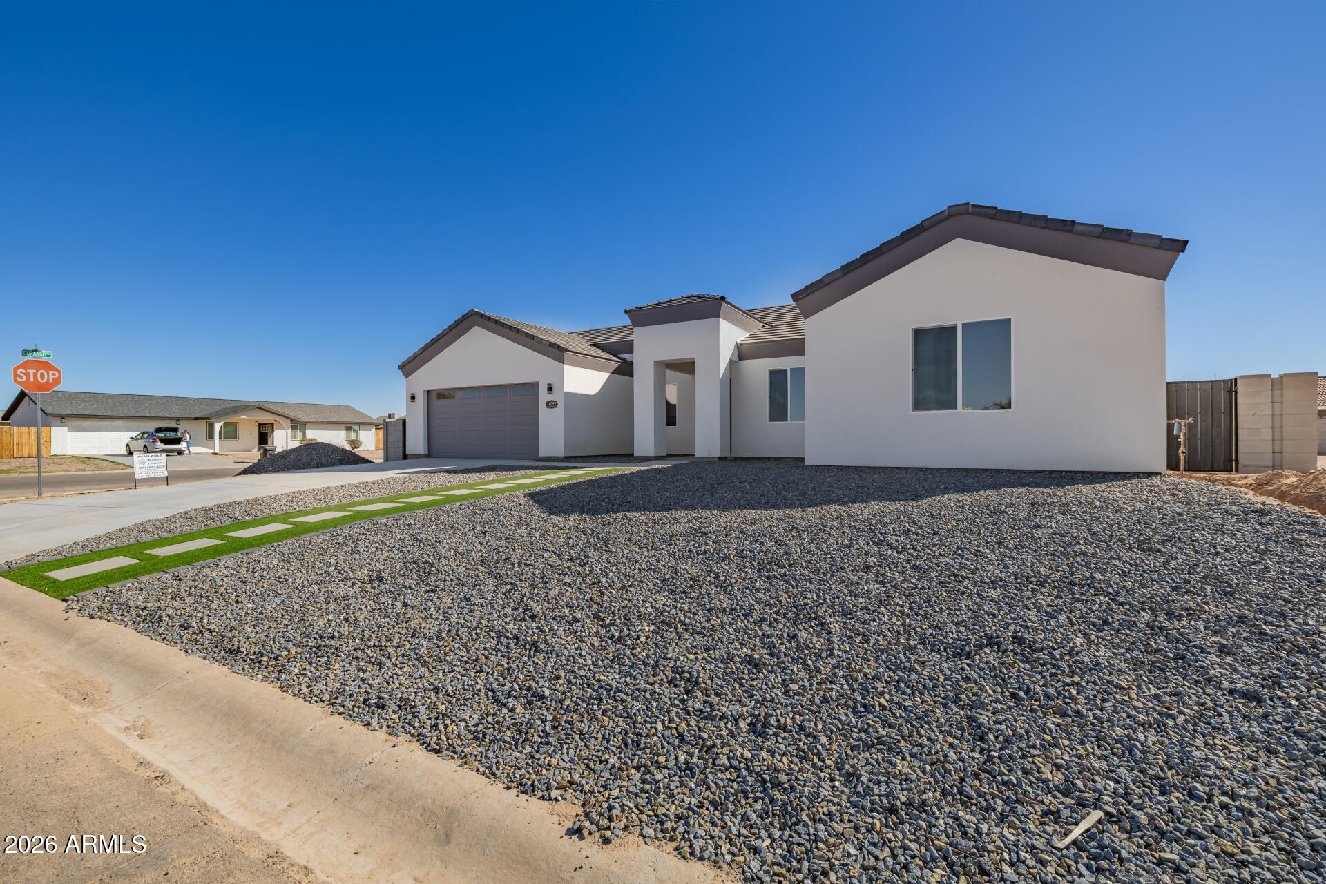 14099 South Vera Cruz Road Arizona City, AZ 85123 - Photo 3 of 32 a view of a house with a yard