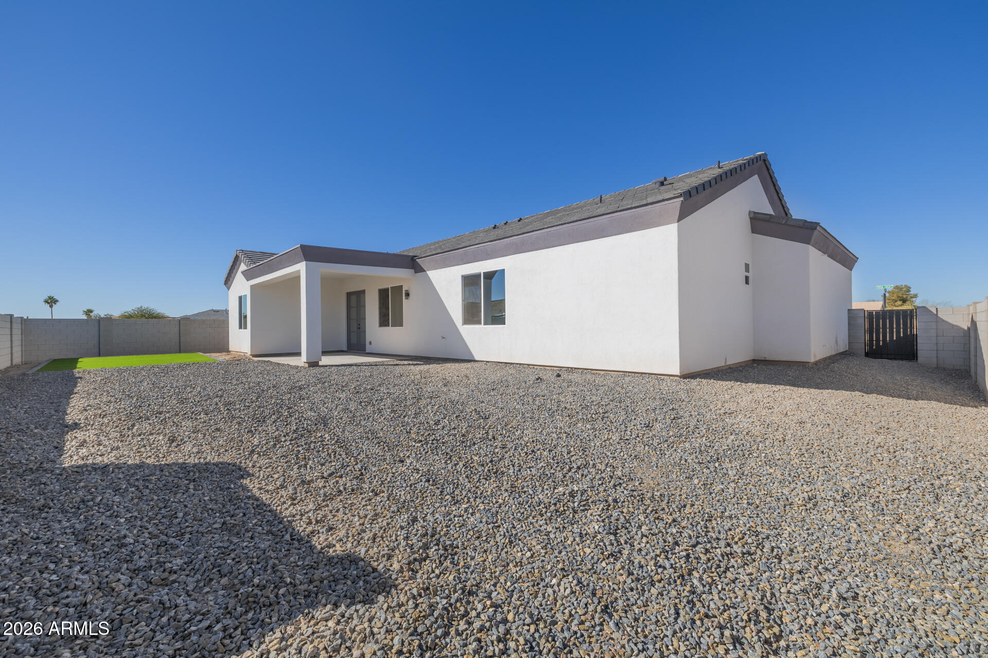 14099 South Vera Cruz Road Arizona City, AZ 85123 - Photo 32 of 32 a view of a house with a backyard