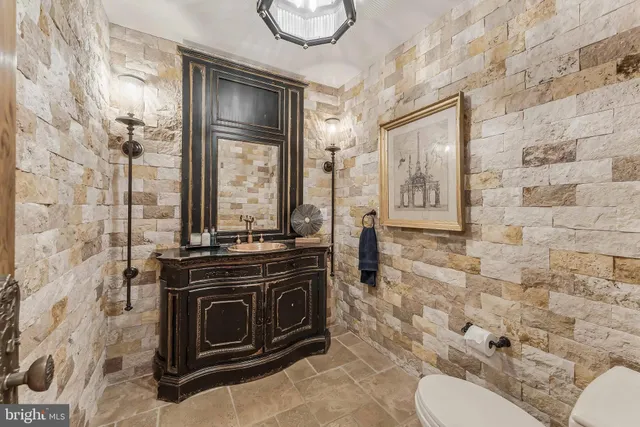 a bedroom with furniture and a large window