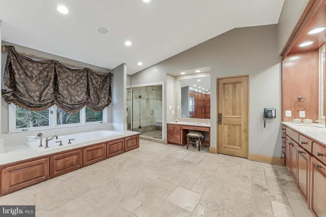 a bedroom with bed and window