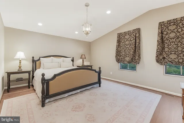 a bed room with a bed and furniture