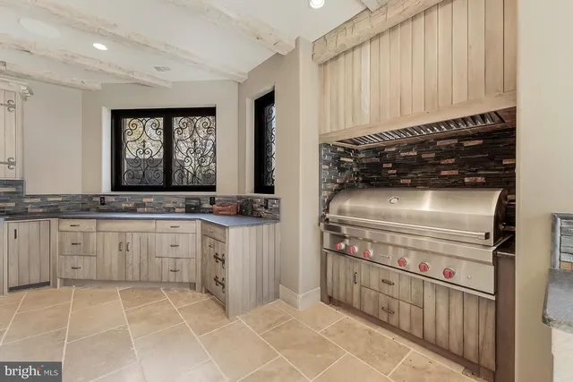 a living room with furniture and white walls