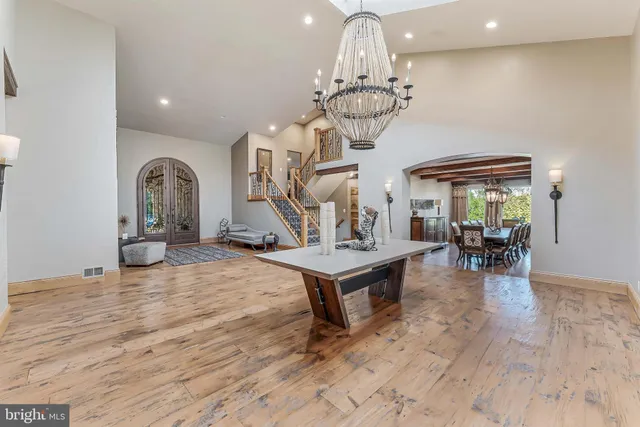 a bedroom with furniture and a chandelier