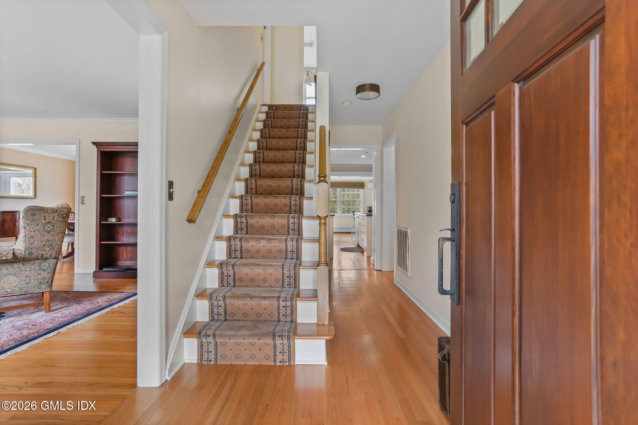 153 Lockwood Road Riverside, CT 06878 - Photo 4 of 58 a view of a hallway with wooden floor and entryway