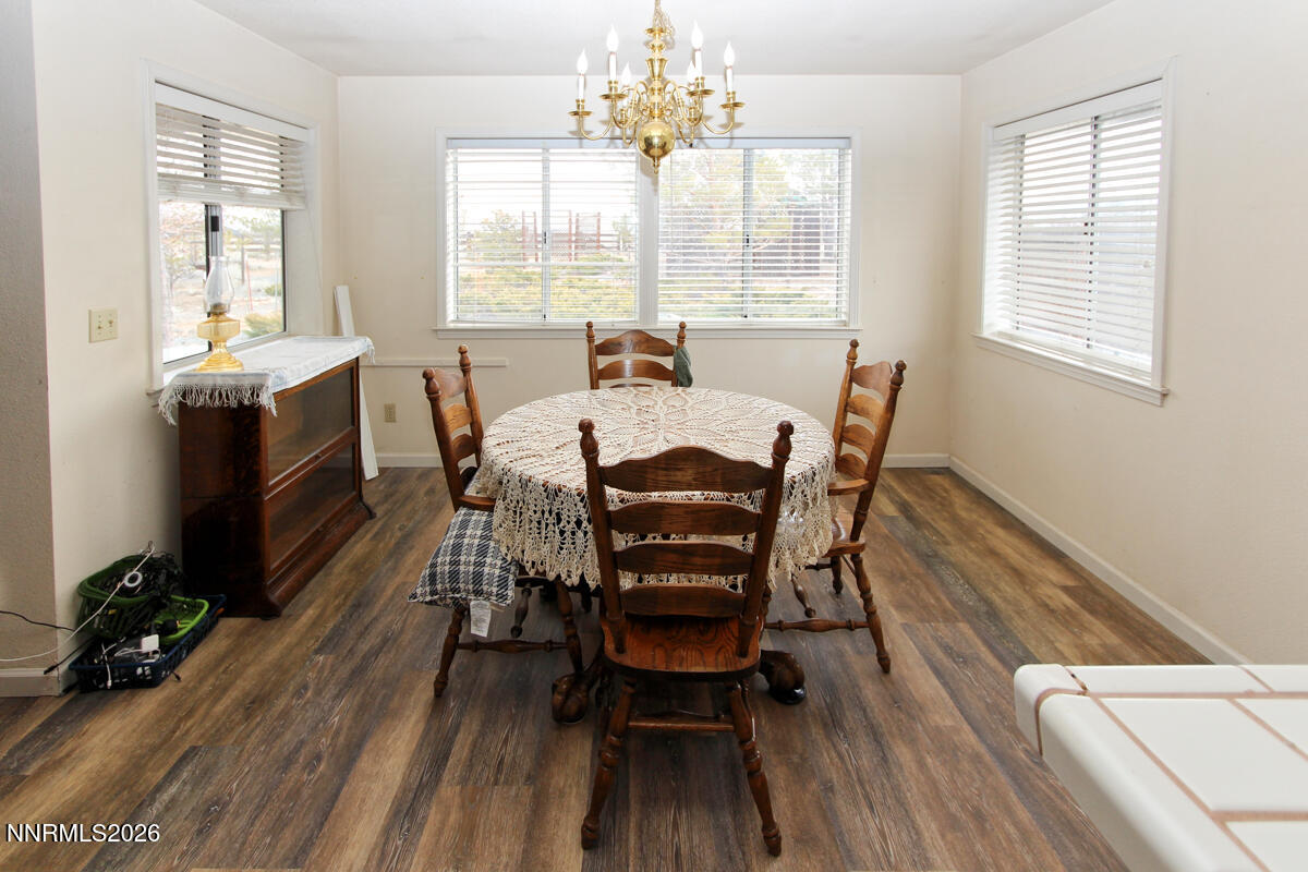 16 Mesa Drive Smith Valley, NV 89444 - Photo 11 of 33 a view of a dining room with furniture window and wooden floor