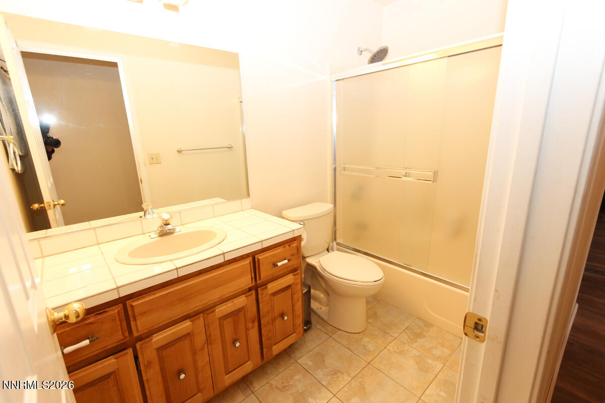 16 Mesa Drive Smith Valley, NV 89444 - Photo 14 of 33 a bathroom with a sink a toilet and shower