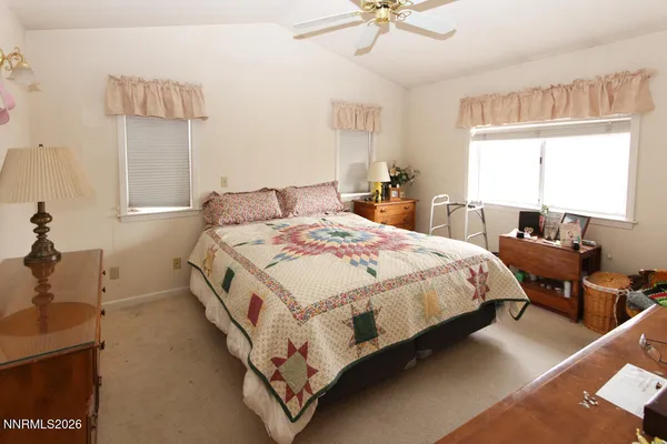 a bed room with a bed and a chandelier