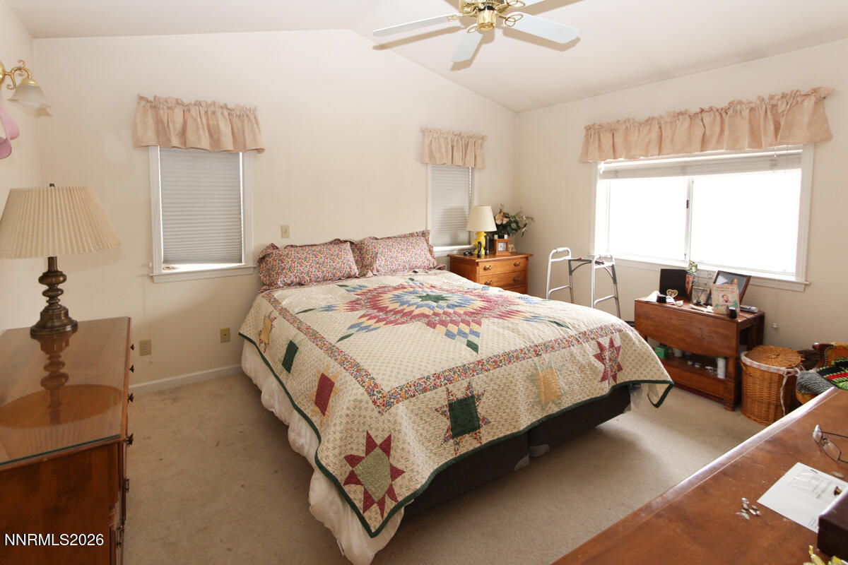 16 Mesa Drive Smith Valley, NV 89444 - Photo 15 of 33 a bed room with a bed and a chandelier