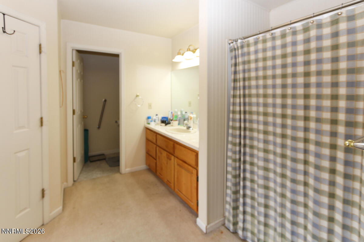 16 Mesa Drive Smith Valley, NV 89444 - Photo 17 of 33 a bathroom with a double vanity sink a mirror and a shower