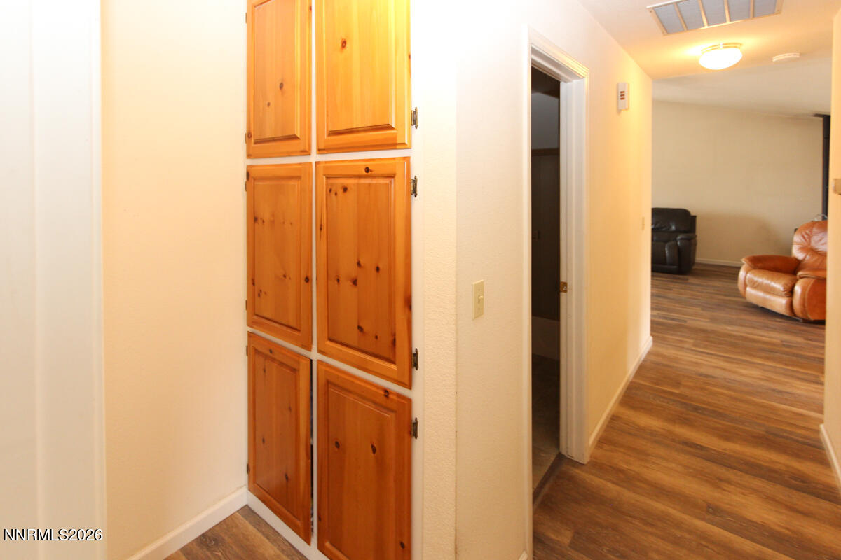 16 Mesa Drive Smith Valley, NV 89444 - Photo 19 of 33 a view of a hallway with wooden floor