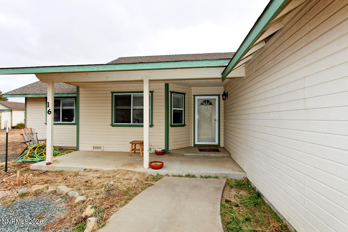 16 Mesa Drive Smith Valley, NV 89444 - Photo 4 of 33 a front view of a house with garden