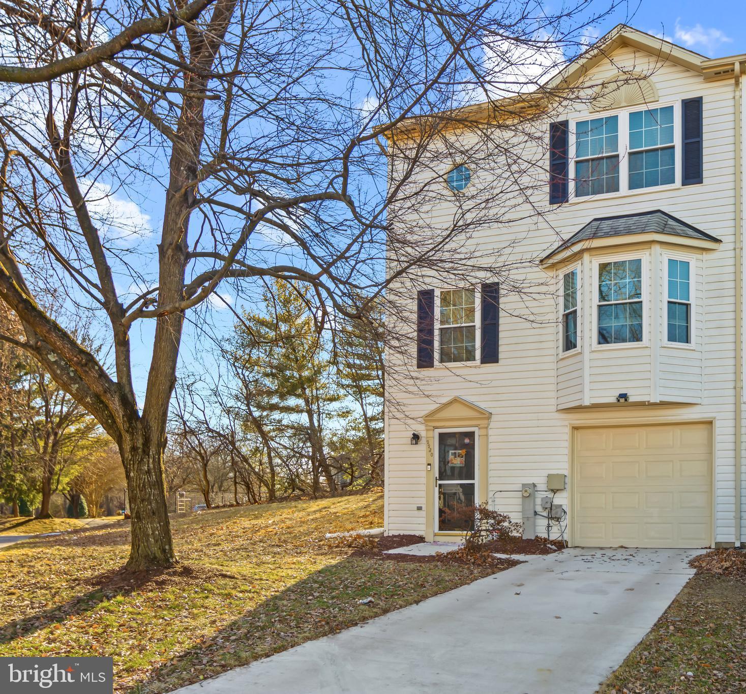 2230 Conquest Way Odenton, MD 21113 - Photo 1 of 47 a front view of a house with a yard
