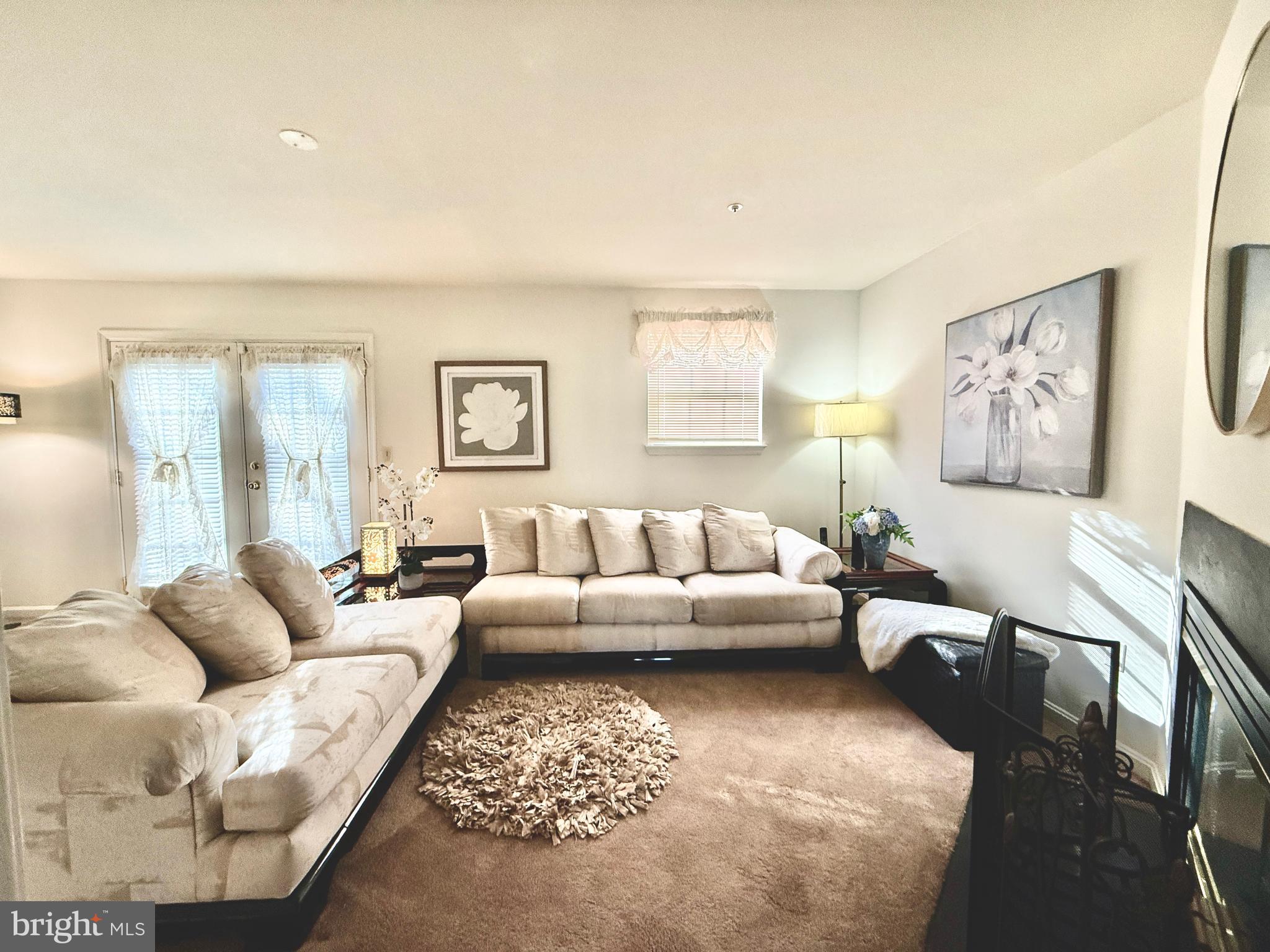 2230 Conquest Way Odenton, MD 21113 - Photo 11 of 47 a living room with furniture potted plant and a window