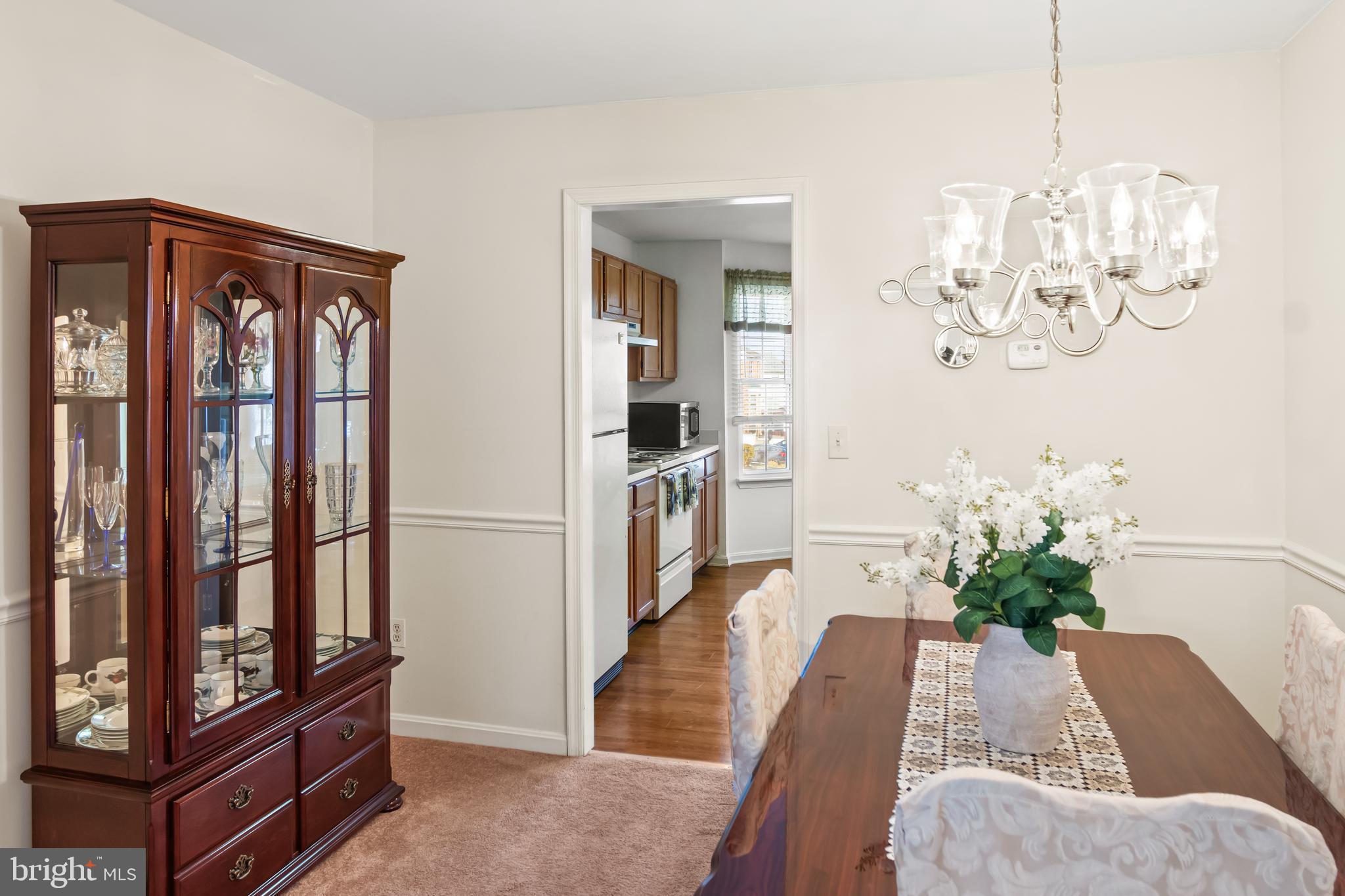 2230 Conquest Way Odenton, MD 21113 - Photo 13 of 47 a living room with furniture and a chandelier