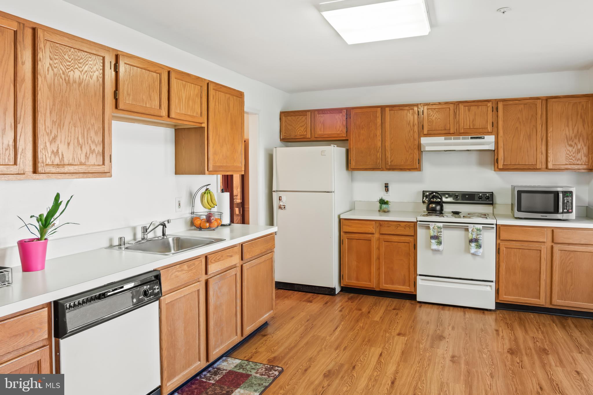 2230 Conquest Way Odenton, MD 21113 - Photo 17 of 47 a kitchen with a sink cabinets stainless steel appliances and windows
