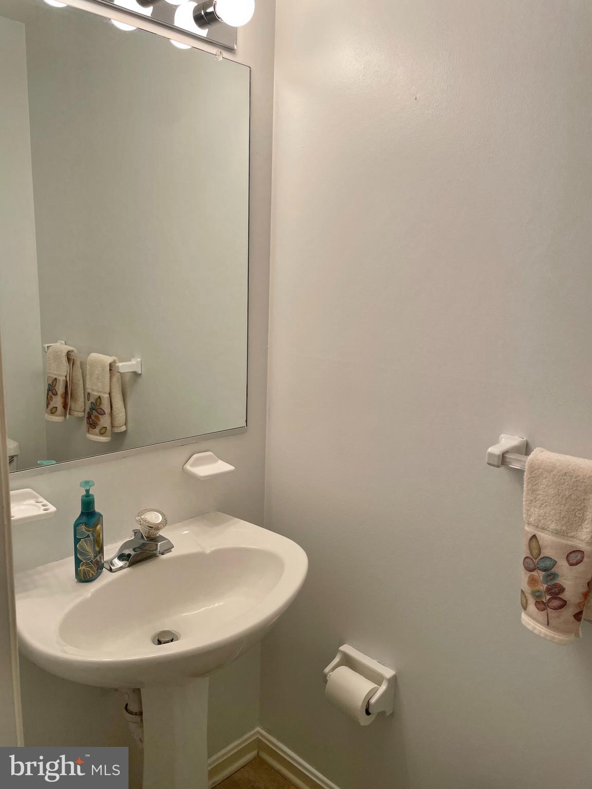 2230 Conquest Way Odenton, MD 21113 - Photo 20 of 47 a bathroom with a sink and a mirror