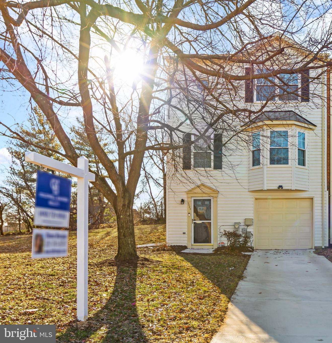 2230 Conquest Way Odenton, MD 21113 - Photo 2 of 47 a front view of a house with a yard