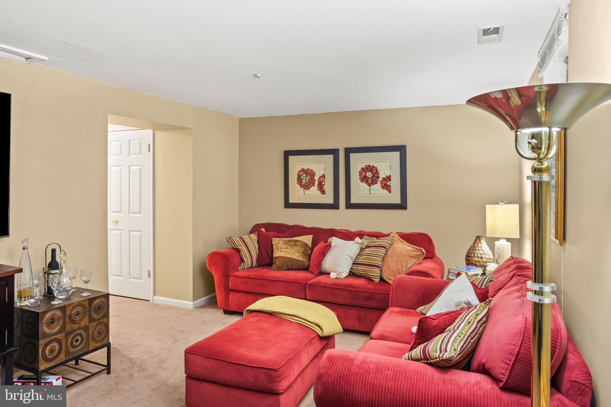 2230 Conquest Way Odenton, MD 21113 - Photo 22 of 47 a blue couch sitting in a living room with a couch
