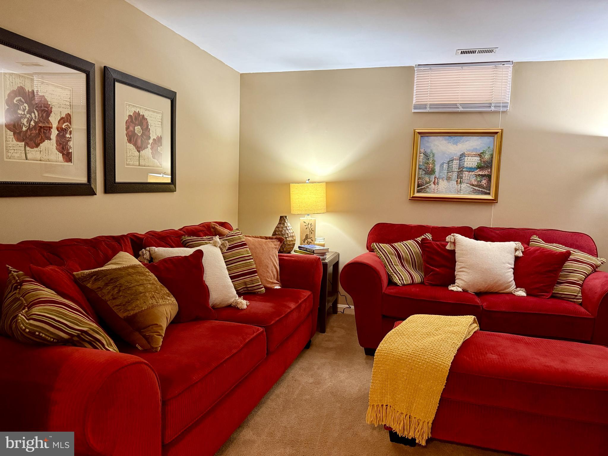 2230 Conquest Way Odenton, MD 21113 - Photo 25 of 47 a living room with a couch and painting on the wall