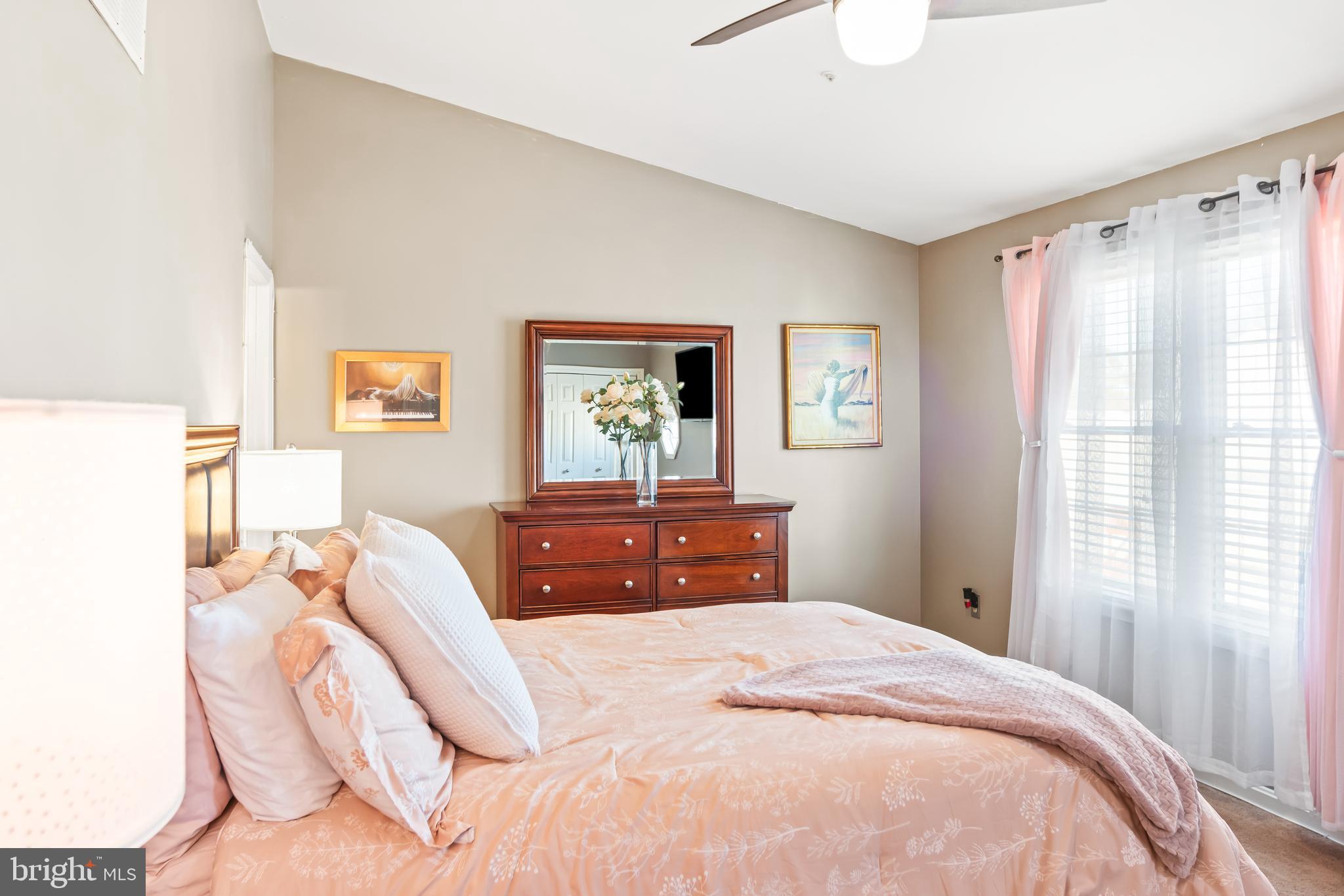 2230 Conquest Way Odenton, MD 21113 - Photo 26 of 47 a bedroom with a bed and wooden floor