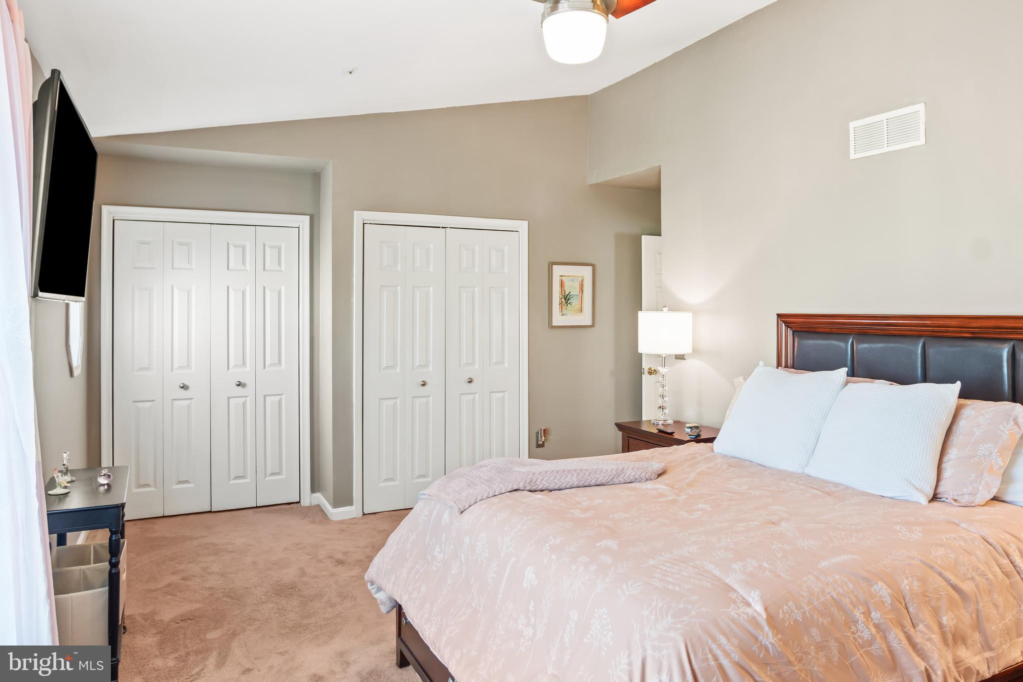 2230 Conquest Way Odenton, MD 21113 - Photo 28 of 47 a bedroom with a bed and painting on the wall