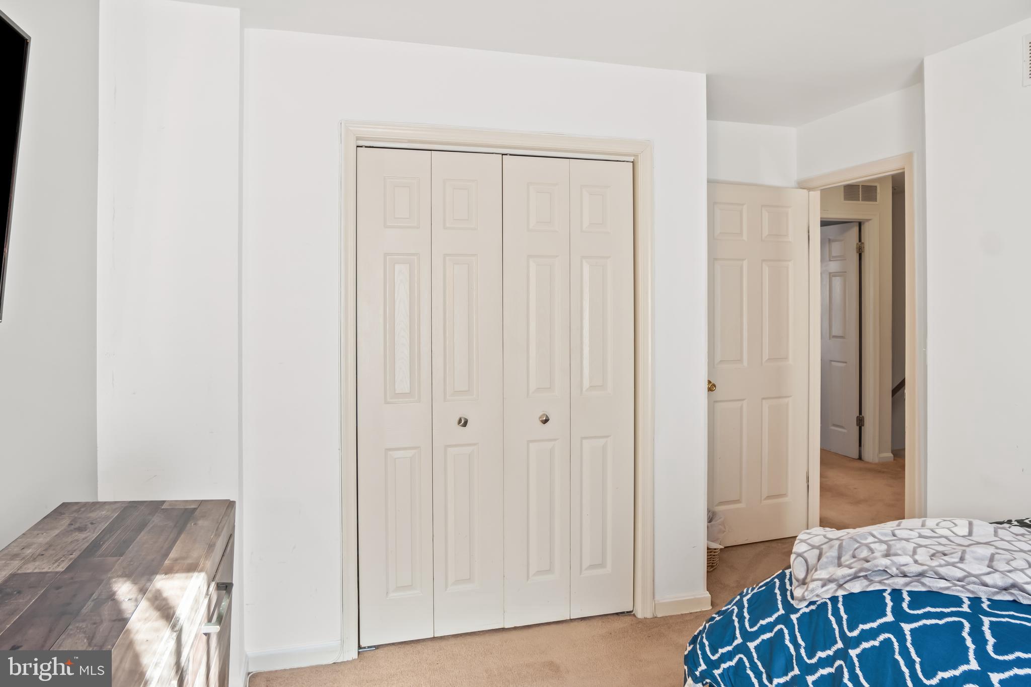 2230 Conquest Way Odenton, MD 21113 - Photo 36 of 47 a bedroom with a bed and a dresser