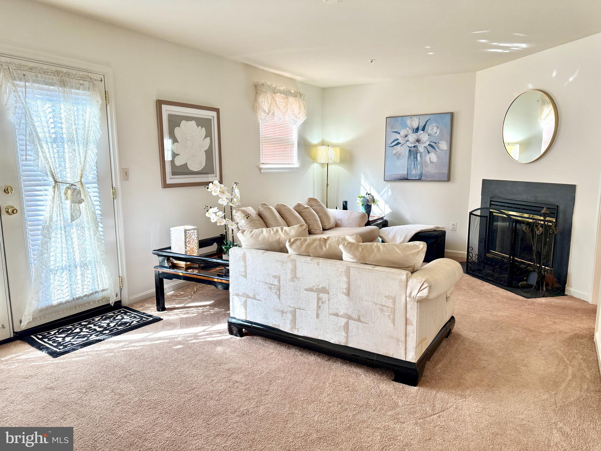 2230 Conquest Way Odenton, MD 21113 - Photo 10 of 47 a living room with furniture a lamp and a window