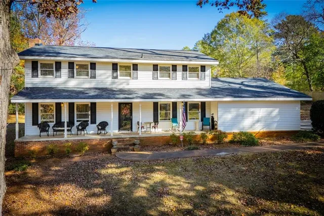 a front view of a house with swimming pool