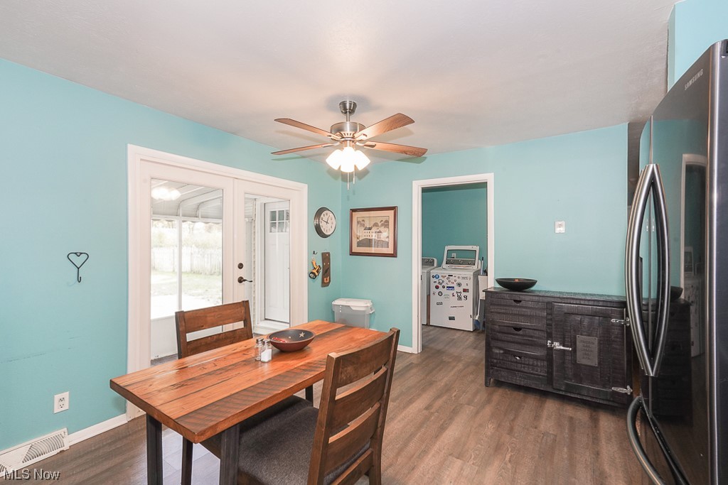 1127 Garden Road Willoughby, OH 44094 - Photo 12 of 33 Dining room featuring dark lvp
flooring and ceiling fan