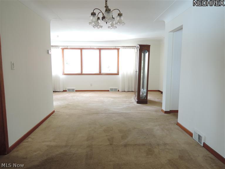 2120 SOM Center Road Cleveland, OH 44124 - Photo 3 of 25 Dining room opens into the living room. Both have hardwood under the carpet.