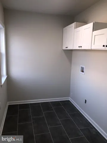 a view of a utility room with a sink