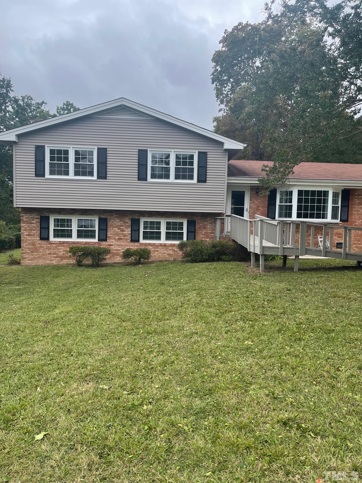 2901 Mars Street Raleigh, NC 27604 - Photo 1 of 26 a front view of a house with garden