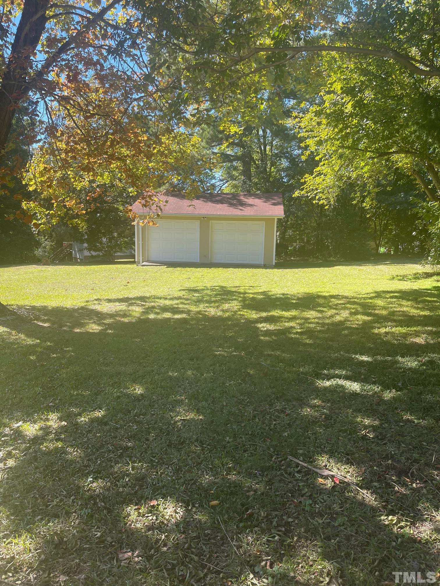 2901 Mars Street Raleigh, NC 27604 - Photo 4 of 26 a view of a large yard with large trees