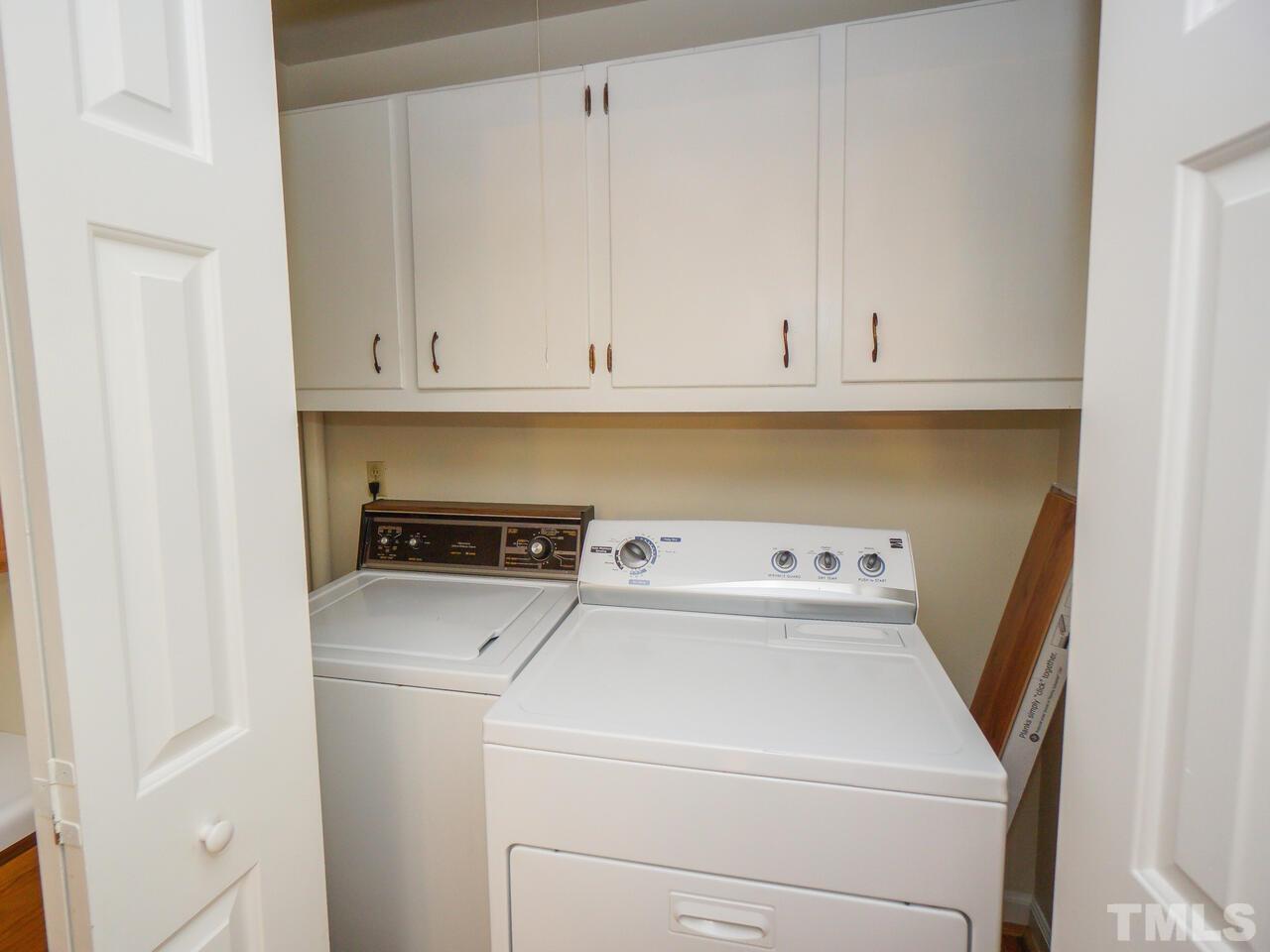 2901 Mars Street Raleigh, NC 27604 - Photo 9 of 26 a view of storage and utility room with washer and dryer