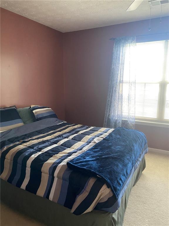 159 Windcroft Lane Northwest Acworth, GA 30101 - Photo 17 of 25 a bedroom with a bed and window