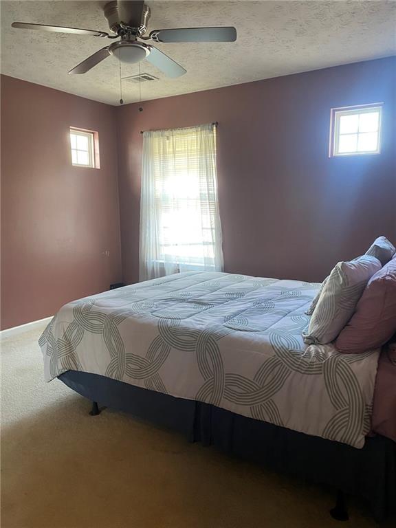 159 Windcroft Lane Northwest Acworth, GA 30101 - Photo 19 of 25 a bedroom with a bed and window
