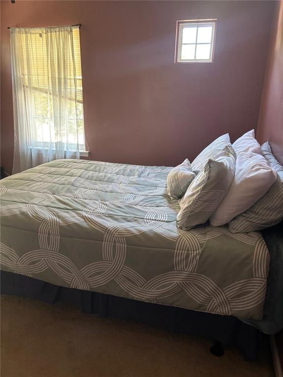 159 Windcroft Lane Northwest Acworth, GA 30101 - Photo 20 of 25 a bedroom with a bed and a window