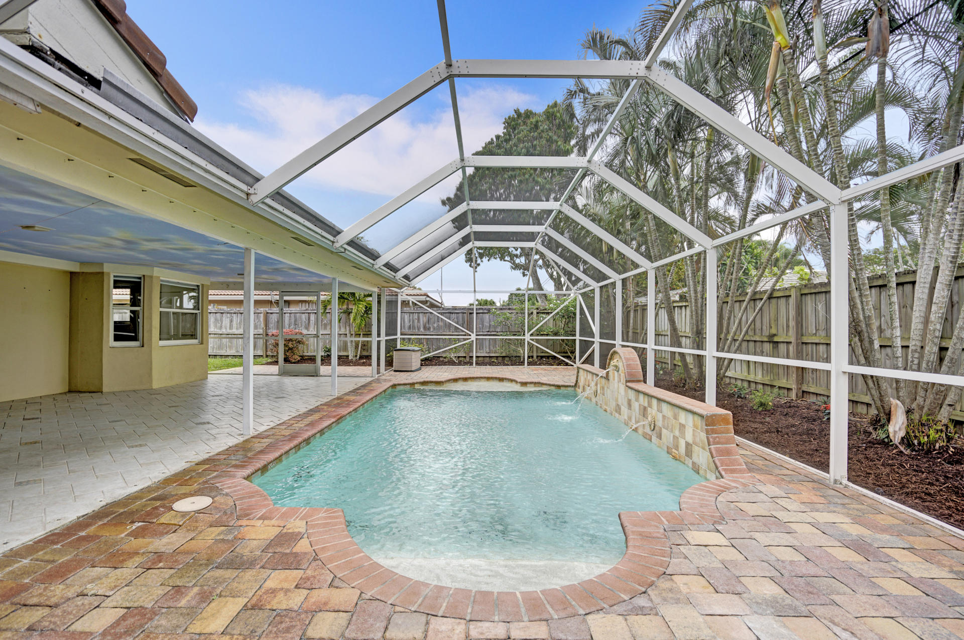 2016 Bethel Boulevard Boca Raton, FL 33486 - Photo 54 of 61 a view of a swimming pool with a patio