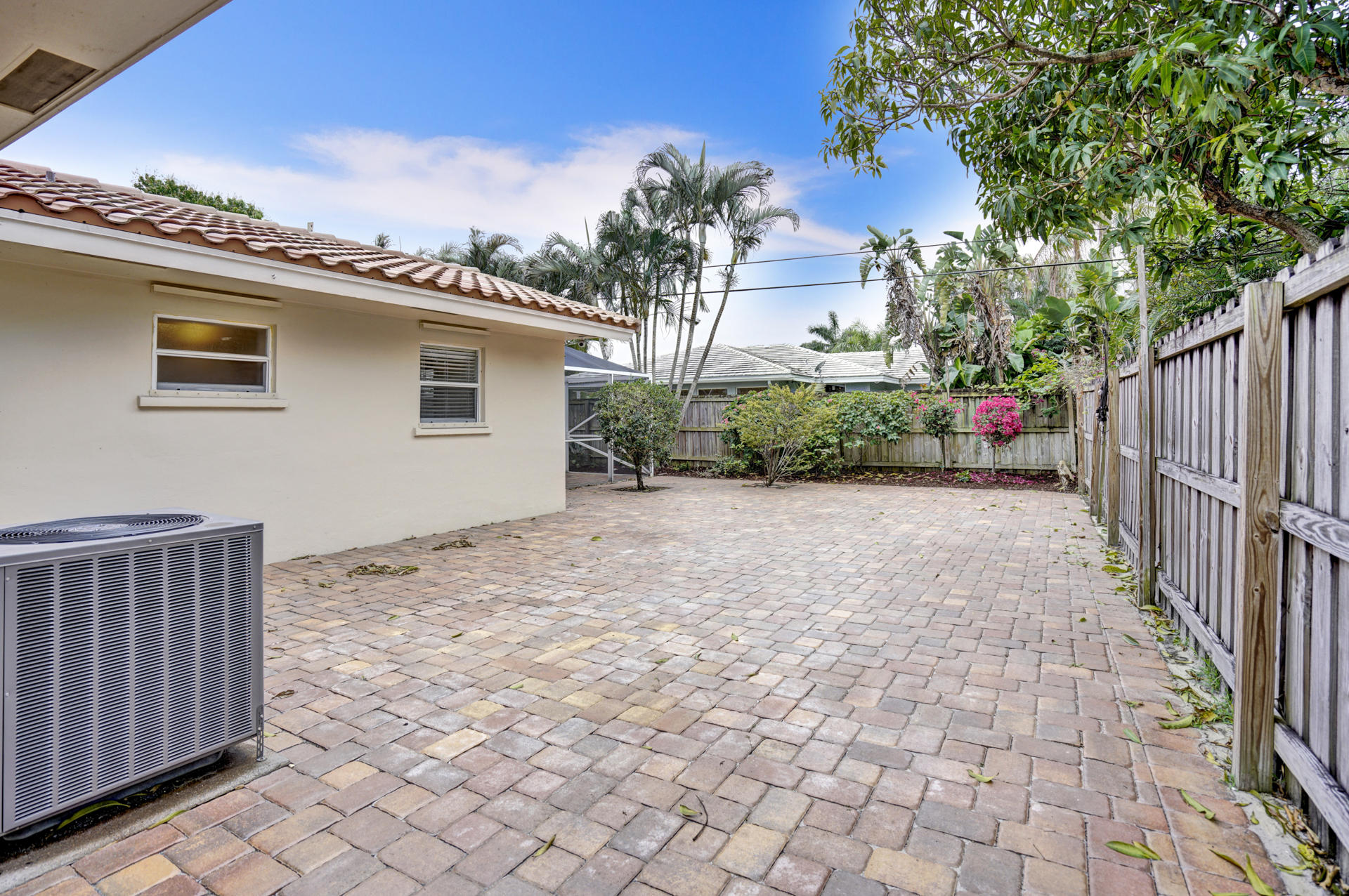 2016 Bethel Boulevard Boca Raton, FL 33486 - Photo 56 of 61 a view of a backyard with plants and wooden fence